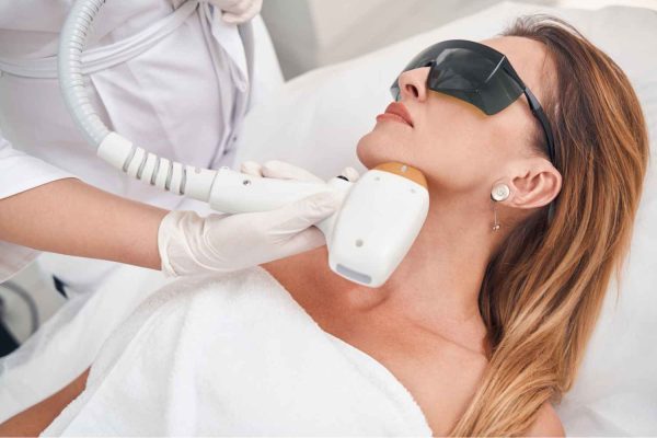 Female Receiving Laser Facials Genesis- One-session treatment | Manhattan Laser Spa in NYC