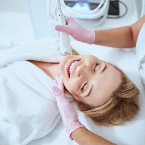 Happy Patient Receiving RF Microneedling Treatment Sessions Three | Manhattan Laser Spa in NYC