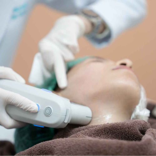 Young Lady Receiving Ultherapy - Lower Neck Treatment | Manhattan Laser Spa in NYC